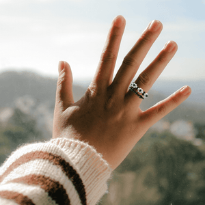 Shungite and flower ring bundle, bringing style and protection to a woman's hand