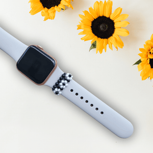 Shungite and flower watch band bundle, on a white smartwatch, providing protection against harmful EMF radiation