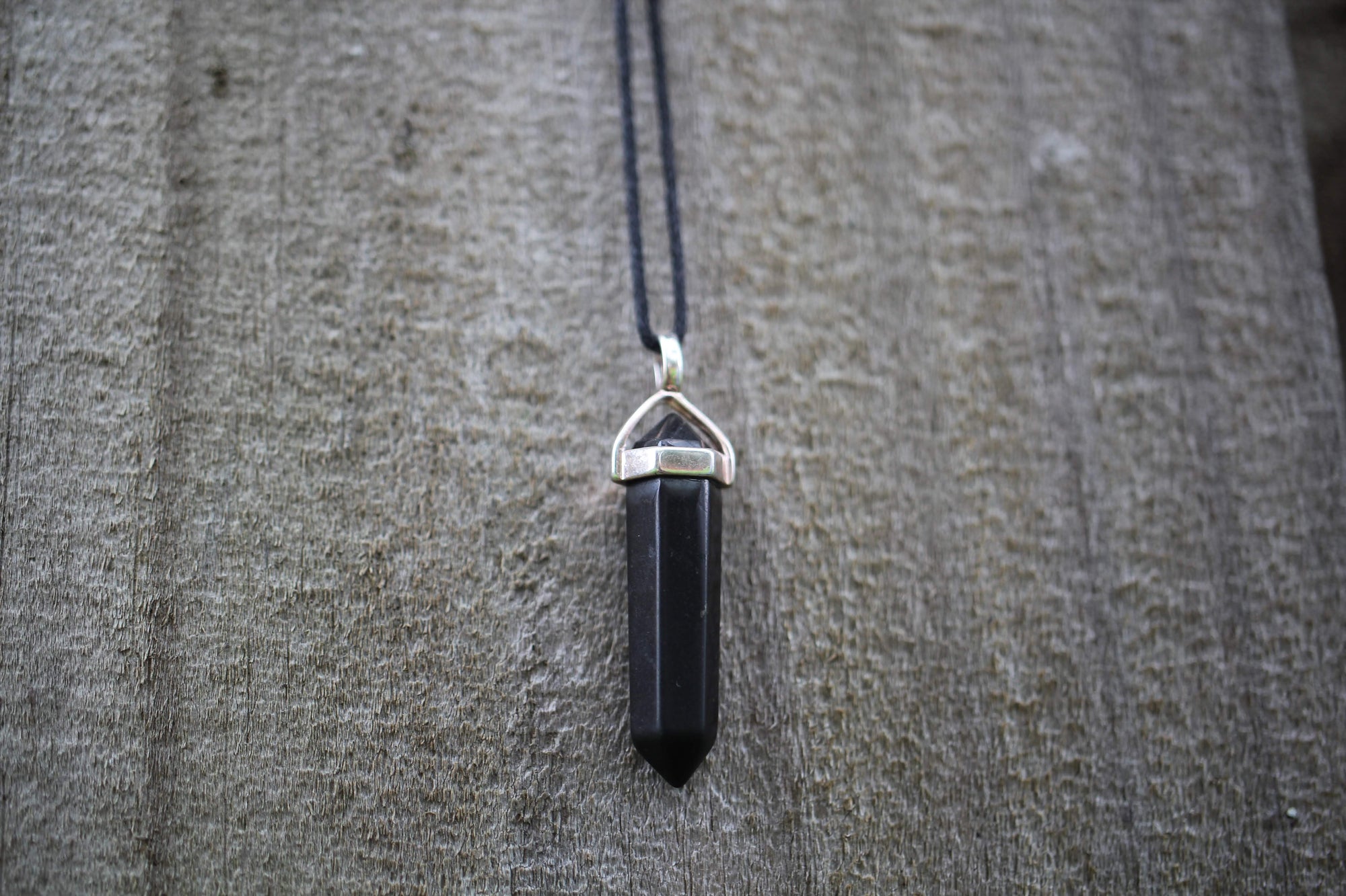 Unisex 6-Point Hexagonal Shungite Pendant Necklace on an adjustable black cord, perfect for all ages