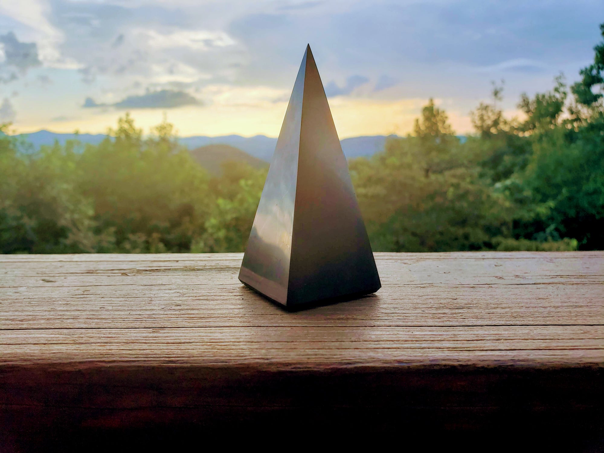 7.5 inch Reiki charged polished Shungite Pyramid will neutralize radiation in a larger room up to a 30-foot radius. 