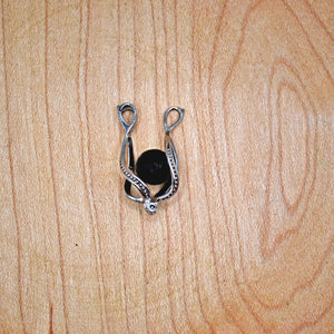 Sterling silver cage with a 6mm shungite stone open and ready to change out the stone inside, with 9 different options