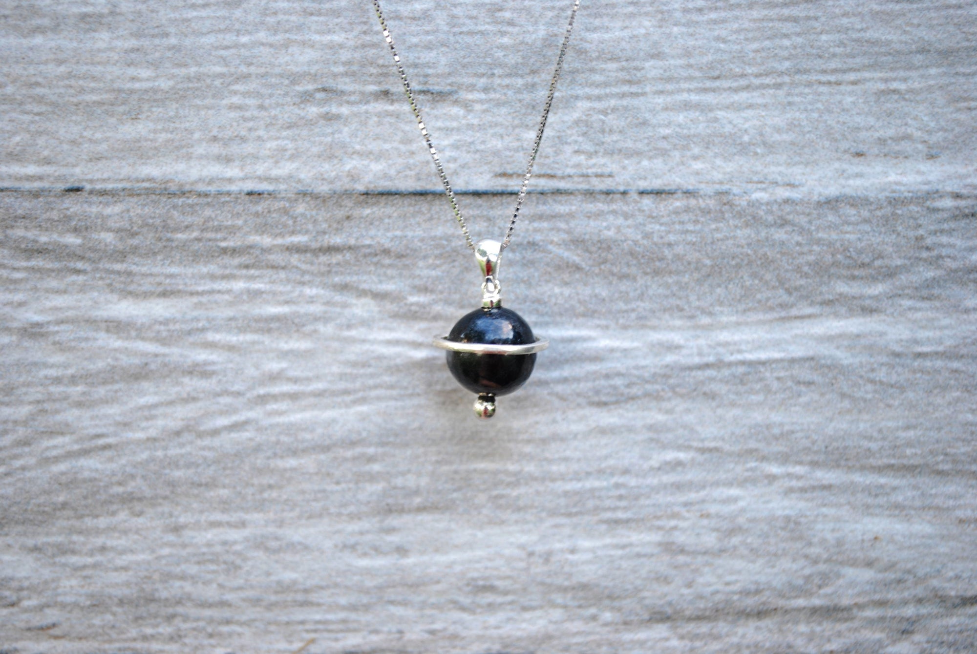 Shungite Orbit Pendant with a 10mm shungite bead, on a sterling silver chain 