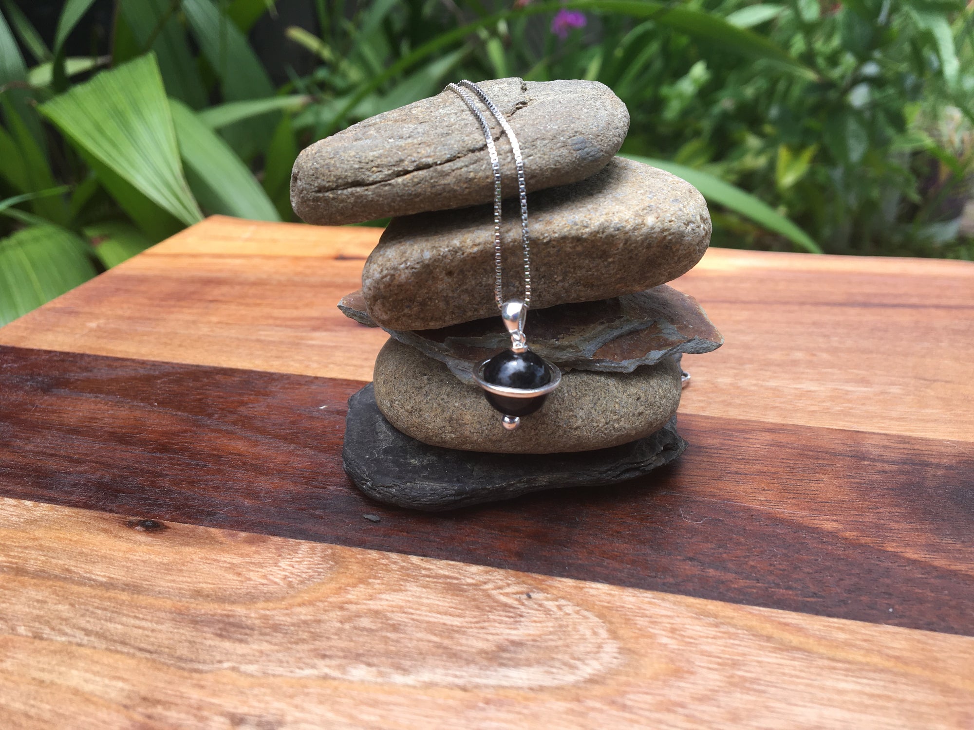 Shungite Orbit Pendant with a 10mm shungite bead, on a sterling silver chain 