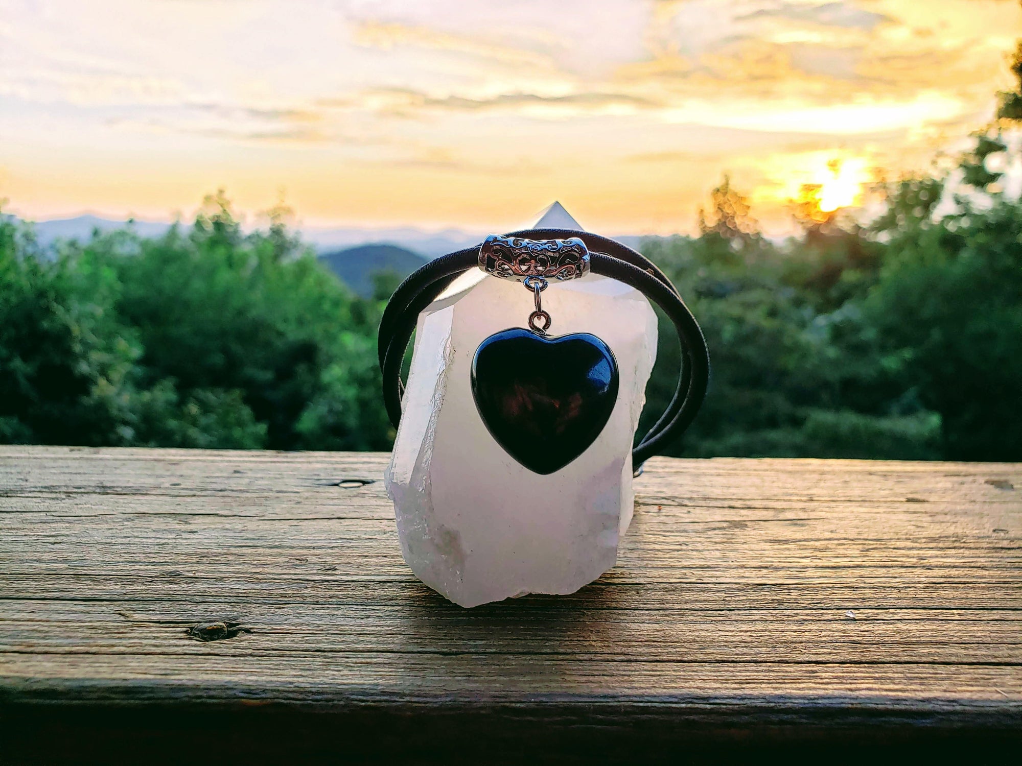 Puffy Heart Polished Shungite Pendant on a braided leather cord and silver-plated bail