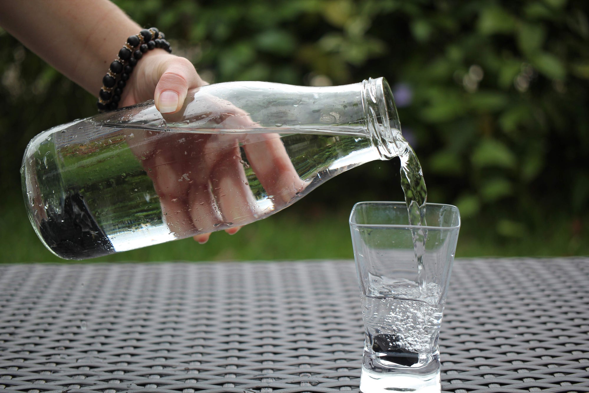 Water pitcher filled with natural shungite rocks, purifies and produces cleaner and healthier drinking water