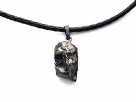 Elite Noble Raw Shungite Pendant with a braided leather cord for maximum EMF protection. Stone size ranges from three to five grams