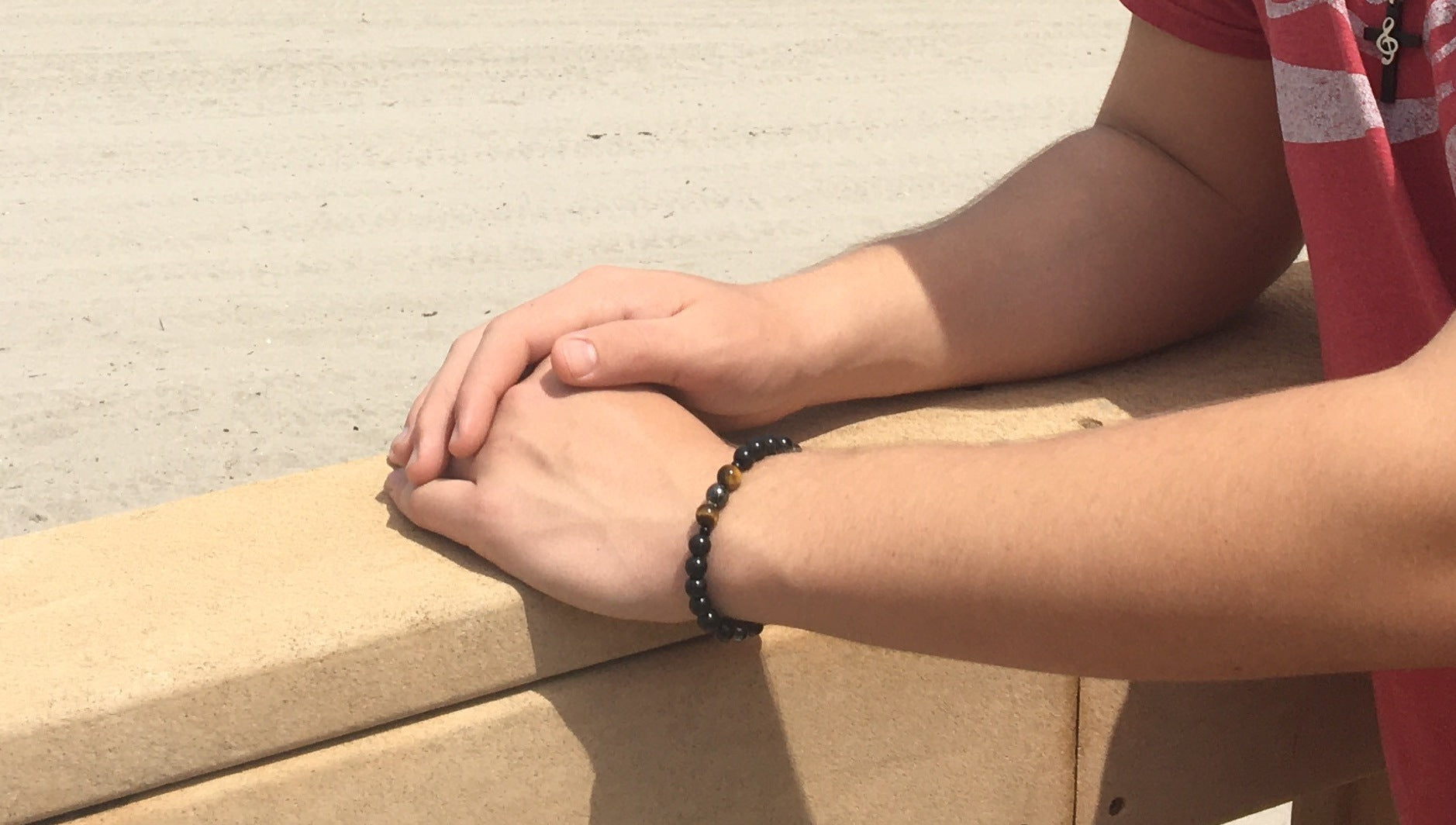 6mm shungite, tiger's eye, and hematite Triple Protection bracelet protecting a teenager