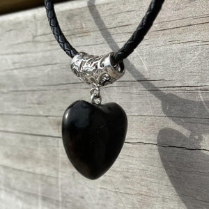 Puffy Heart Polished Shungite Pendant on a braided leather cord and silver-plated bail